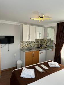 A bed or beds in a room at Tavra hotel
