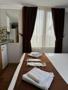 A bed or beds in a room at Tavra hotel