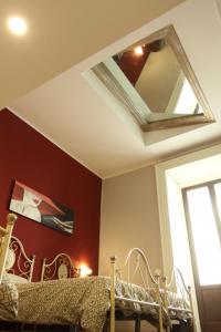 Letto o letti in una camera di B&B Suite Cutelli