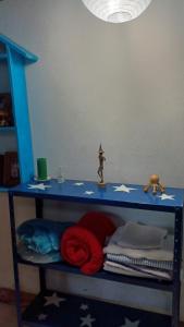 a blue shelf with stars on it with towels at Estância Verde in Valença +27 photos
