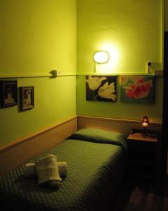 Postel nebo postele na pokoji v ubytování Albergo Casa Lupi