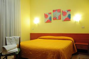 Postel nebo postele na pokoji v ubytování Albergo Casa Lupi