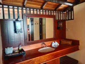 a bathroom with a sink and a mirror at Koh Mook Sivalai Beach Resort in Ko Mook