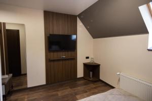TV a/nebo společenská místnost v ubytování Prime Hotel