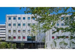 a white building with a sign on the side of it at dogo hakuro - Vacation STAY 79568v in Matsuyama +24 photos