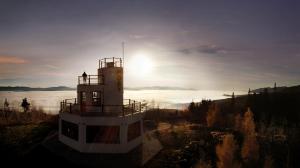 a light house in front of a body of water at APLEND Monte Móry in Štrbské Pleso