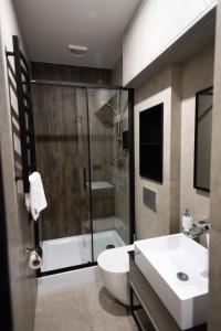 Koupelna v ubytování Prime Hotel + 23 fotografií