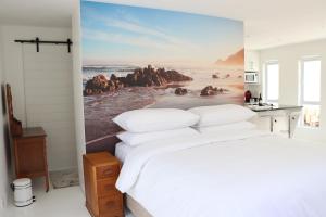 Ένα ή περισσότερα κρεβάτια σε δωμάτιο στο Nivenia Beach House