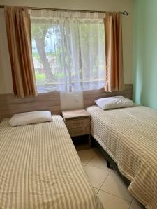 Postel nebo postele na pokoji v ubytování Ocean Breeze Condo