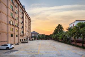 an empty parking lot in the middle of a building at Rose Garden International Hotel in Phnom Penh