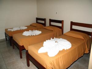 A bed or beds in a room at Scala Hotel Barretos