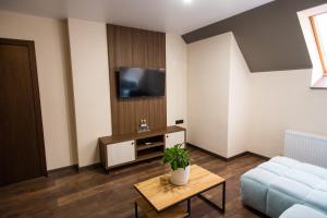 TV a/nebo společenská místnost v ubytování Prime Hotel