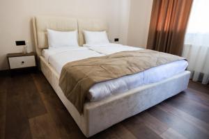 Postel nebo postele na pokoji v ubytování Prime Hotel
