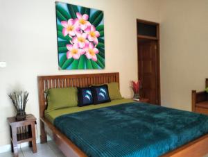 Postel nebo postele na pokoji v ubytování Kaia Lovina Guest House