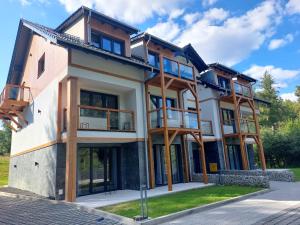 a house being built with wooden beams at Mountain Lodge Studio Forset View in Szklarska Poręba