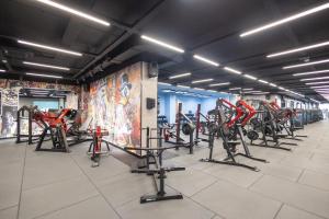 a gym with a bunch of bikes in a room at Mercure Prishtina City in Pristina +50 photos