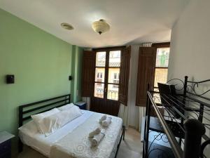 Postel nebo postele na pokoji v ubytování Hostal El Olivo