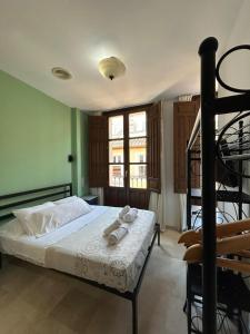 Postel nebo postele na pokoji v ubytování Hostal El Olivo