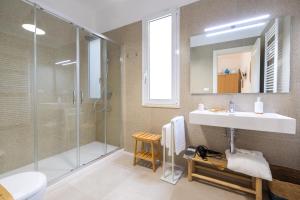 a bathroom with a shower and a sink and a mirror at Villa De Nuzzo - Bed & Breakfast in Torre San Giovanni Ugento
