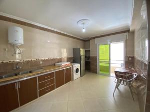 a kitchen with a sink and a dishwasher at Mosaic Appartments in Tetouan