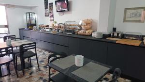 Reštaurácia alebo iné gastronomické zariadenie v ubytovaní Hotel Ogliastra