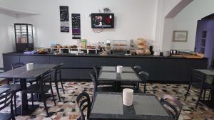 Reštaurácia alebo iné gastronomické zariadenie v ubytovaní Hotel Ogliastra