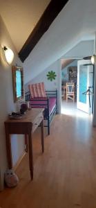 a living room with a table and a couch at Ferienwohnung mit herrlichem Moselblick in Piesport