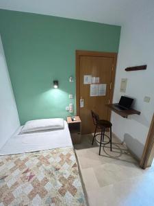 Postel nebo postele na pokoji v ubytování Hostal El Olivo
