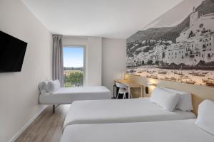 Postel nebo postele na pokoji v ubytování B&B HOTEL Girona 3 + 32 fotografií