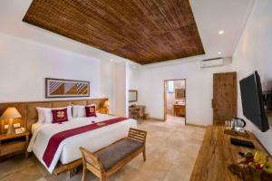 Katil atau katil-katil dalam bilik di Zyandru 1 BR Deluxe Garden View ZN175