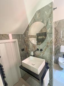 a bathroom with a sink and a mirror at Appartamento Piccolo Principe in Monterosso al Mare +37 photos