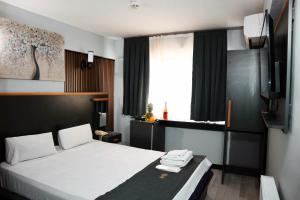 a hotel room with a bed and a window at Grand Onur Hotel in Istanbul