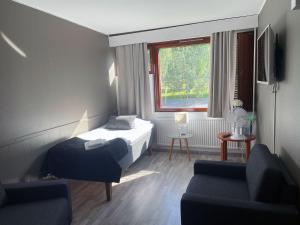 Ένα ή περισσότερα κρεβάτια σε δωμάτιο στο Ellivuori Resort
