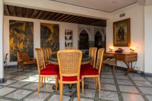 a dining room with a table and chairs at LUXURY apartment in Marrakesh