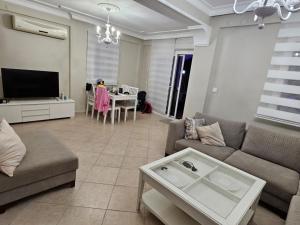 a living room with a couch and a table at Villa à Turgutreis in Bodrum City