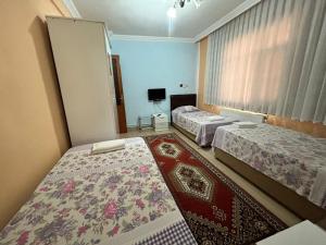 Postel nebo postele na pokoji v ubytování Ernur Pension