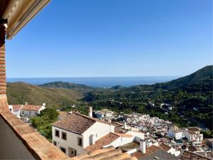 a view of a town from the roof of a building at Ojen Penthouse in Ojén