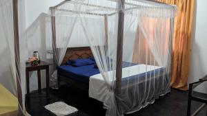 Postel nebo postele na pokoji v ubytování Mirissa Senaliya Guest