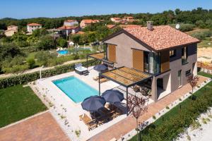 an aerial view of a house with a swimming pool at Villa Albona in Poreč