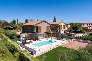 an aerial view of a house with a swimming pool at Villa Albona in Poreč