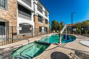 a swimming pool in front of a building at Metro Tempe Extended Stay - 2 Full Beds in Tempe