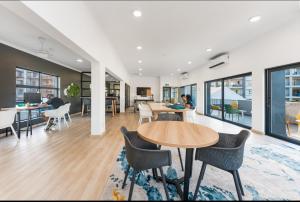 an open office with tables and chairs and a living room at Ballito Escape in Ballito