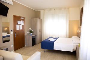 Postel nebo postele na pokoji v ubytování Hotel Mare Live