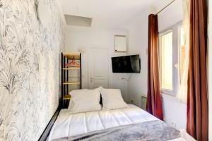 Ένα ή περισσότερα κρεβάτια σε δωμάτιο στο Bluestay 187 - Charmant studio à Paris