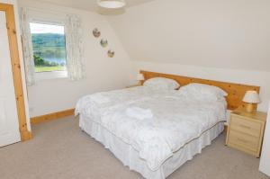 Cama ou camas em um quarto em Blarghour Farm Cottages