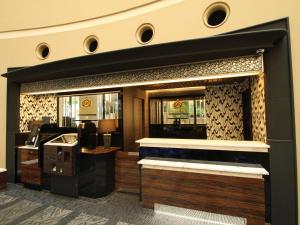 a lobby of a hotel with a reception desk at APA Hotel Fukuoka Watanabedori Ekimae EXCELLENT in Fukuoka