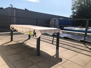a bench sitting on top of a roof at Barrierefreie Ferienwohnung in Erkelenz