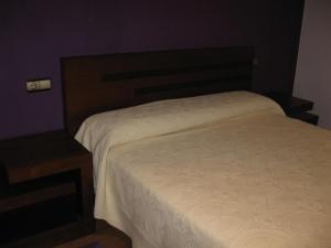 Postel nebo postele na pokoji v ubytování CASA PEDRASRUBIAS