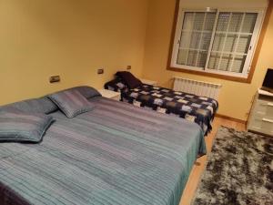 Postel nebo postele na pokoji v ubytování CASA PEDRASRUBIAS
