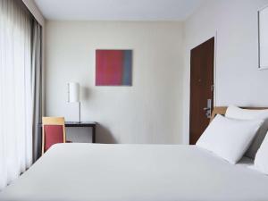 Postel nebo postele na pokoji v ubytování Novotel Athens